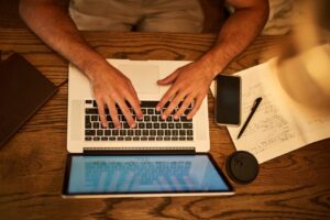 Aerial view of a man using a laptop.
