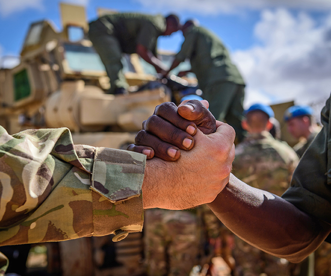 Close up of a handshake between two army officers Image: © UK MOD Crown Copyright