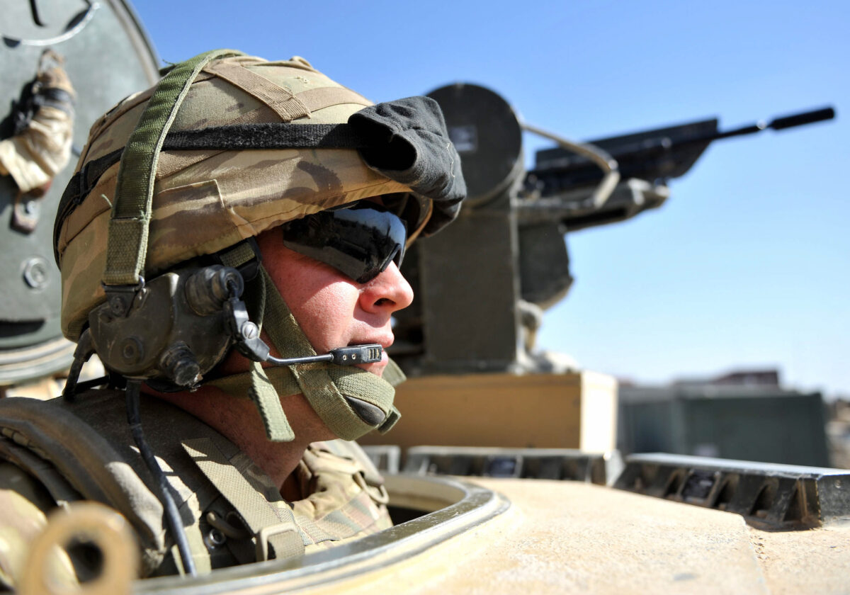 Male Royal Engineer sitting in an armoured vehicle