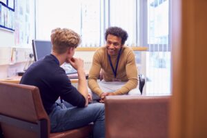 Teacher talking with a student.