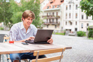 distance learning student working on his employability skills with laptop