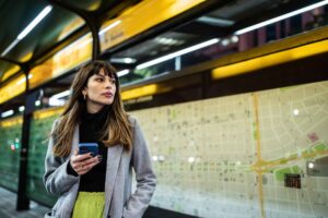 A businesswoman standing in a subway station