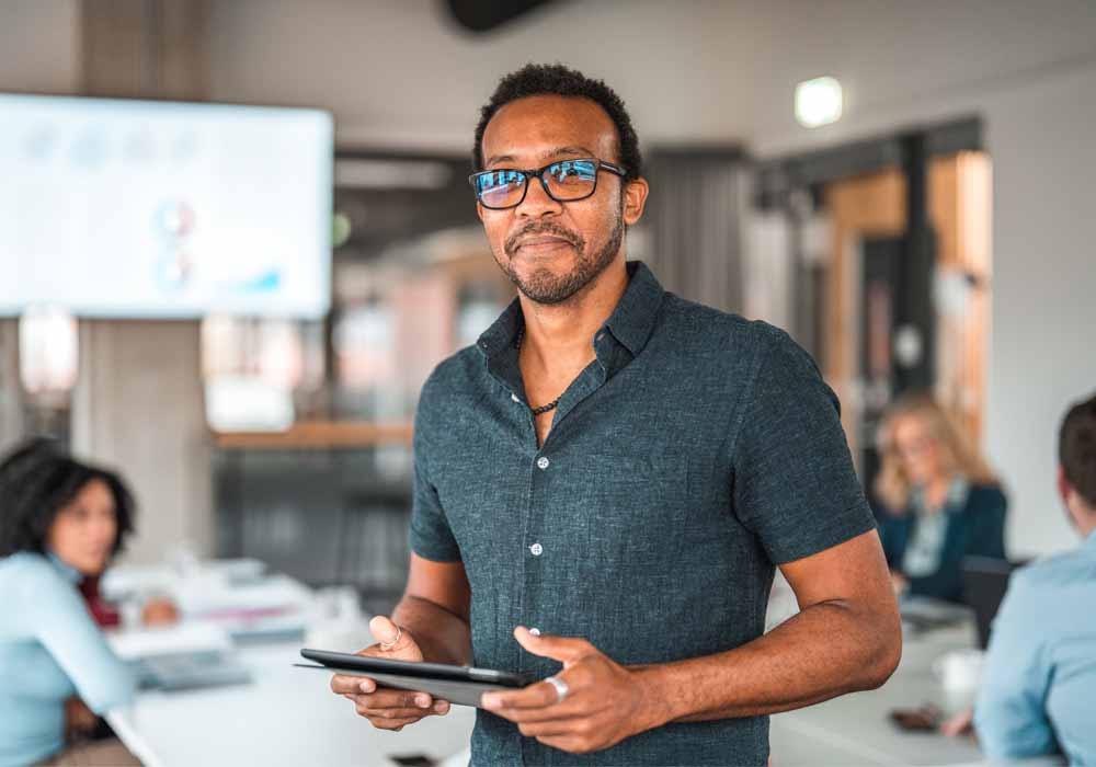Businessman Using a Digital Tablet to demonstrate AI work