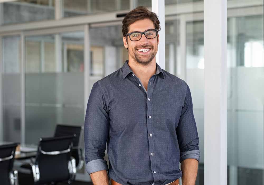 A law professional standing in his office