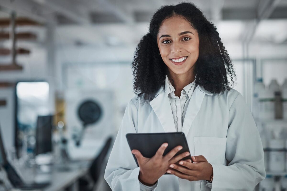 Female health worker smiling at camera for What can you do with a master's in public health promotion blog